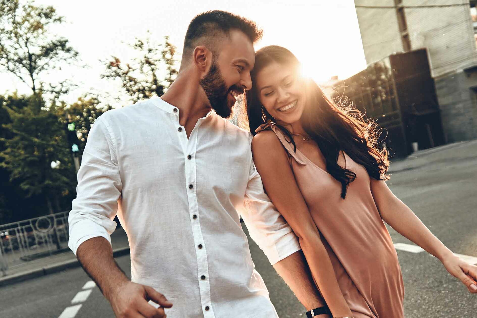 Couple Crossing Street Laughing - Communication