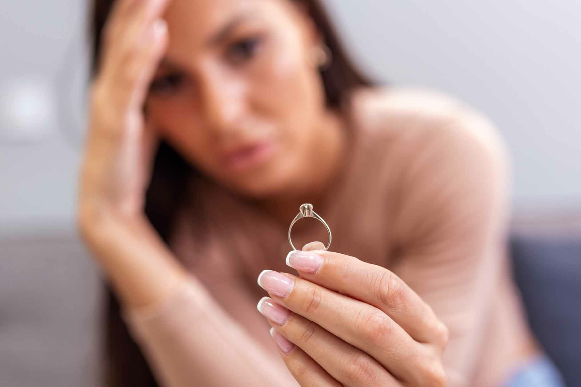 Woman Contemplates Dating After Divorce while Staring at her Ring