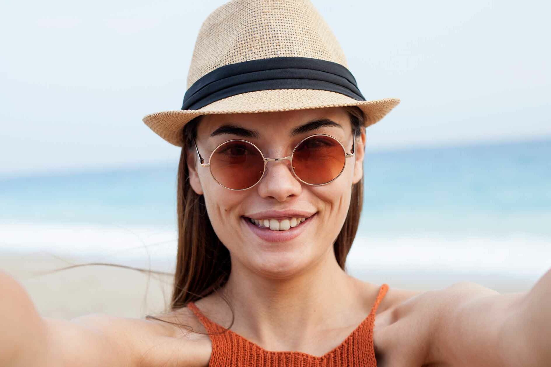 Woman Takes Selfie on Beach for Her Profile Picture