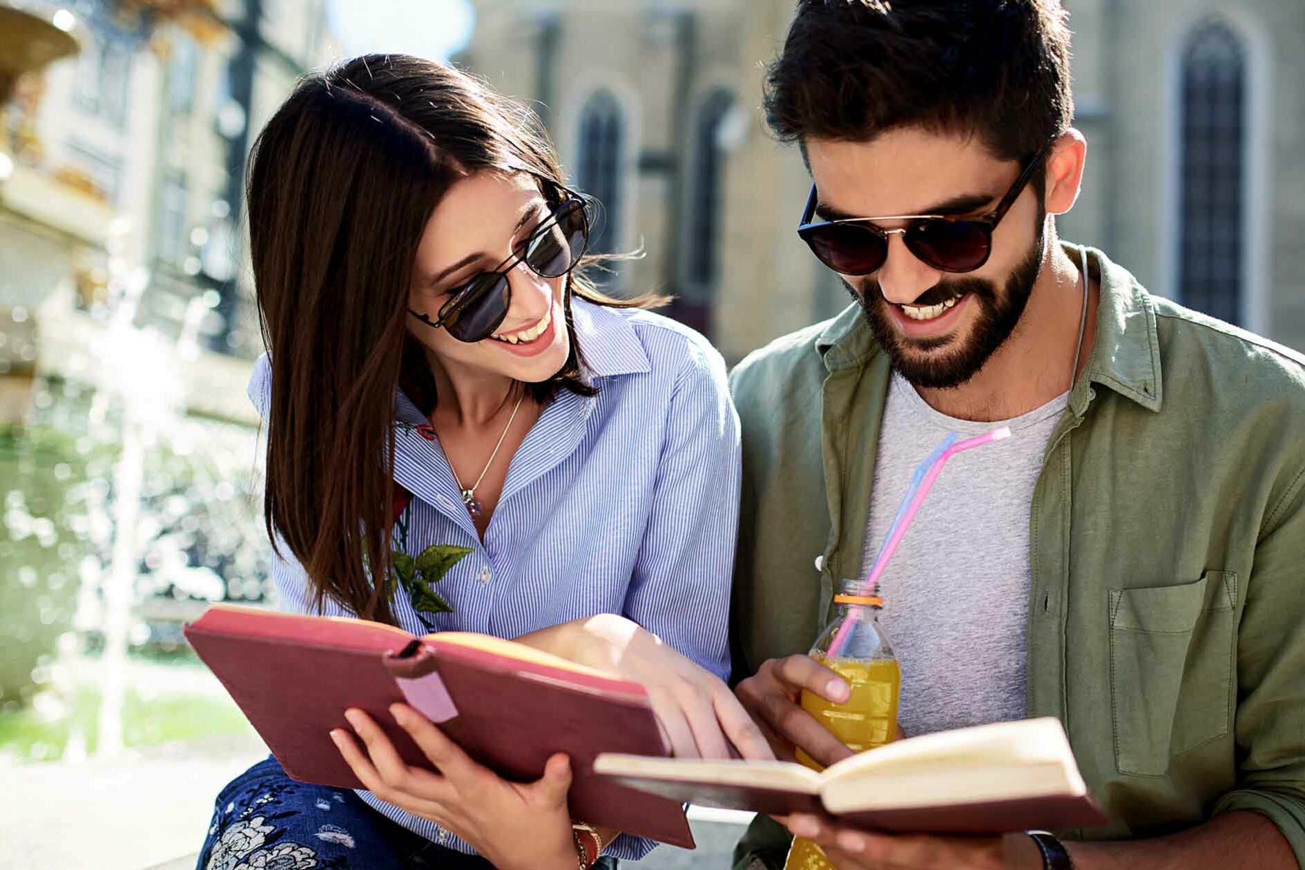 Couple Reads #DatingDictionary Next to Fountain