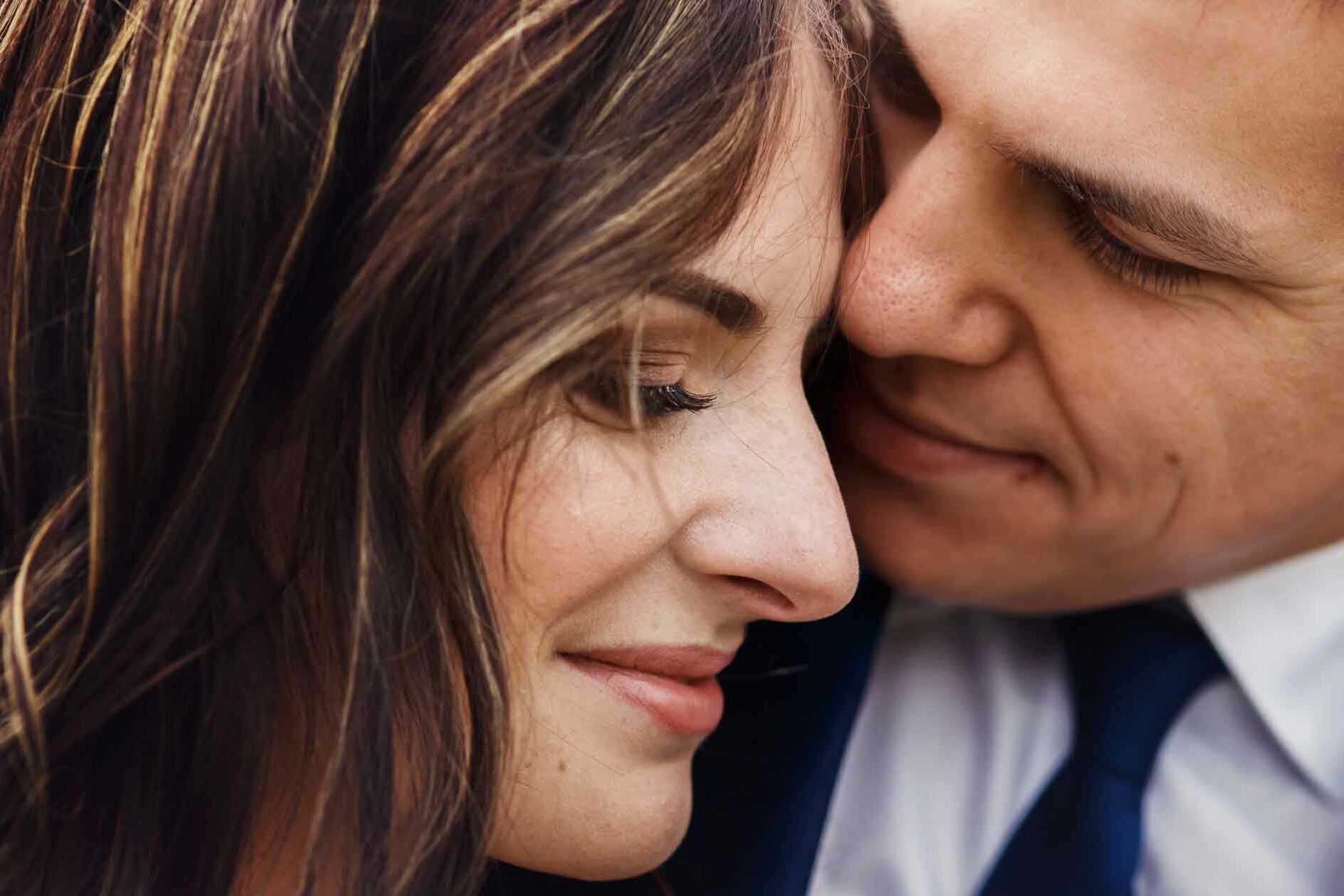 Man in Suit Cuddles Woman - Keep romance Alive