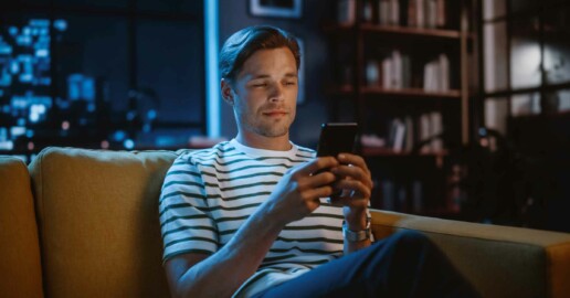 man texting smiling